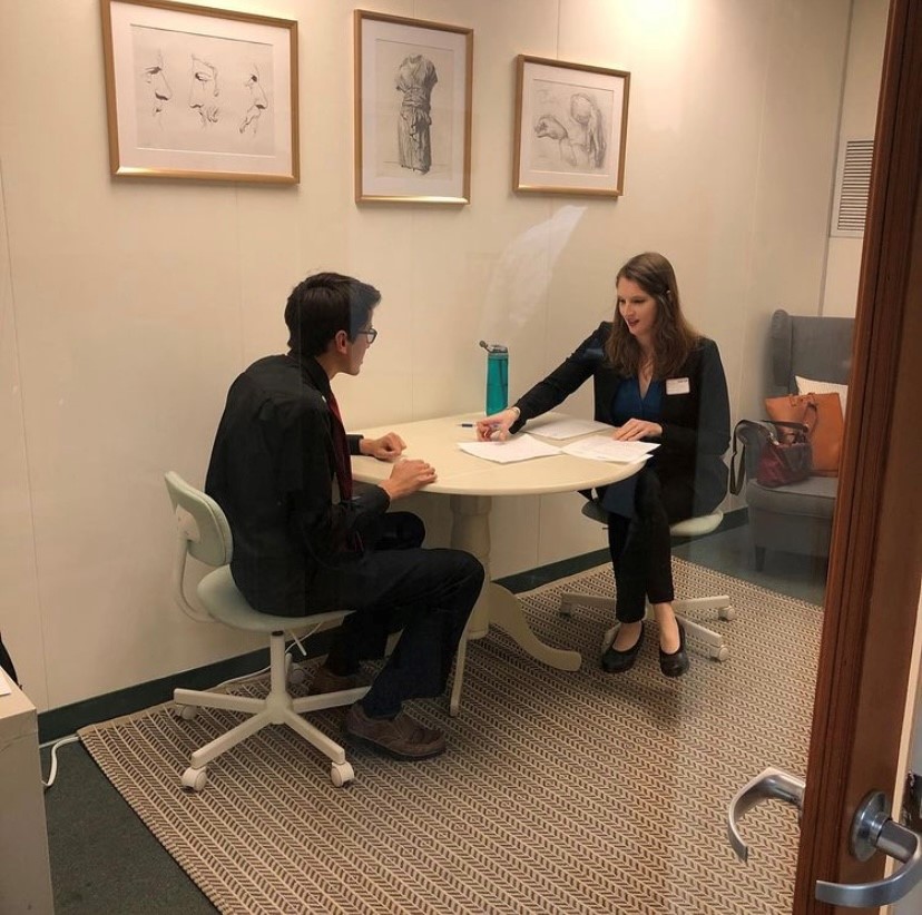 MedBridge employee assisting a student with their resume